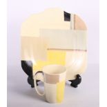 A set of four Susie Cooper geometric/cubist mugs, 4" high, and a matching sandwich plate
