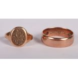 A 9ct gold signet ring and a 9ct gold wedding band, 9.3g