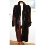 A beaver lamb full length fur coat by Sears & Wells