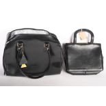 Two ladies black handbags, signed L Credi & Antoni