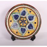 A Carlo Manzoni, Minerva Art ware (ex Della Robbia Birkenhead) Arts & Crafts charger, 10 1/4" dia