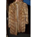 A fox fur three-quarter length coat