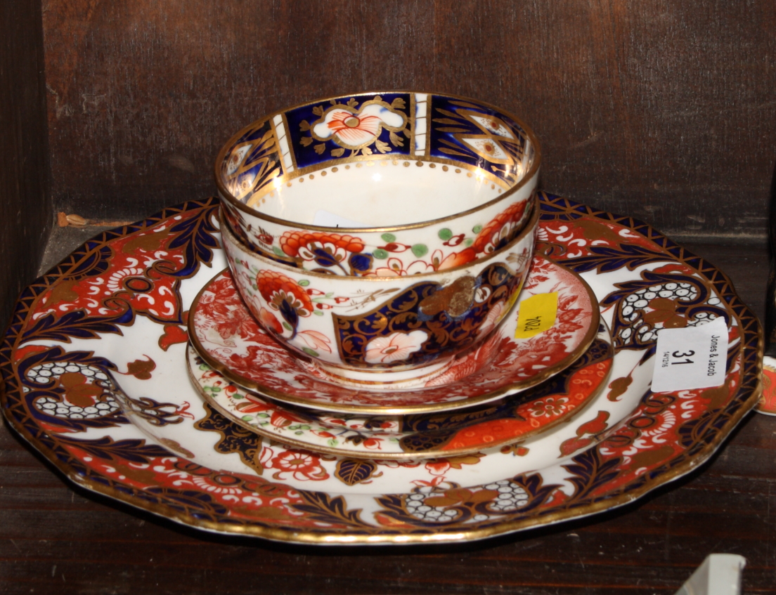 A Bloor Derby Imari pattern tea bowl, a similar early 19th Century Derby tea bowl, a similar saucer,