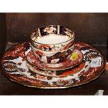 A Bloor Derby Imari pattern tea bowl, a similar early 19th Century Derby tea bowl, a similar saucer,