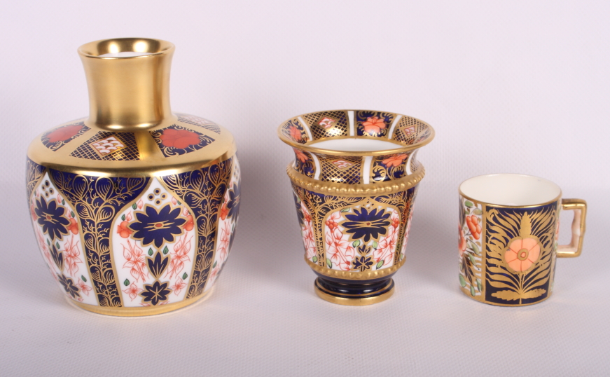 A Royal Crown Derby vase, pattern 1128, 4" high, a similar miniature vase and a similar miniature