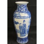 A 20th century blue and white vase with Chinese figures, 45cm high.