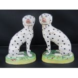 A pair of 19th century seated Staffordshire Dalmatian dogs,