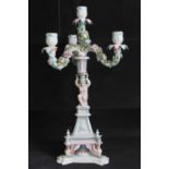 A continental three armed candelabra on a triangular form base supported by three sphinxes,