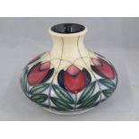 A Moorcroft squat vase with stylized tulip design.