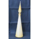 An opaque yellow chemist style tapering bottle having spire stopper,