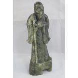 A late late 19th/early 20th century carved soapstone figurine of an Oriental gentleman, 24cm high,