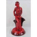 A Peggy Davies flambe Art Deco style figurine of a lady; 27cm high.