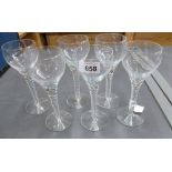 Six tall modern wine glasses with twisted stems; each 19.5cm high.