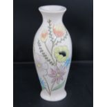 A Burslem potery vase with sgraffito floral design, 16cm high.