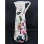 A Moorcroft jug with Bramble revisited design, 19cm high.