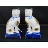 A pair of reproduction small Staffordshire cats; each 10cm high.