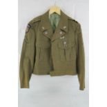 A WWII US Army dress jacket with badges