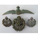 Four British Royal Flying Corp cap and jacket badges.