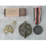 Three WW2 Nazi badges: an SS Death's head; SA badge;