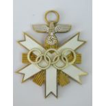 A Nazi Olympic Grand Cross with white enamel; 6cm long.