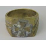 A reproduction German Iron Cross brass ring.