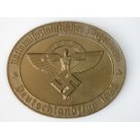 A good quality reproduction Nazi "NSFK 1938" bronzed metal plaque; 9.5cm oval.