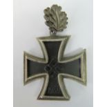 A good quality reproduction WW2 Nazi Knight's Cross with oak leaves; 4.8cm wide.