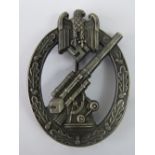 A good quality reproduction Nazi Army flak badge with case.