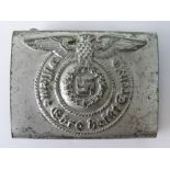 A WW2 Nazi SS belt buckle in white metal; 6.5cm wide.