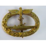 A good quality reproduction WW2 Nazi U-boat badge in gilt metal;