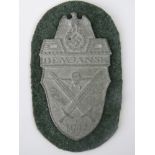 A WW2 Nazi "Demjansk 1942" shield on cloth backing; 9cm long.