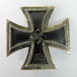 A reproduction WW2 German Iron Cross, First Class; 4.4cm wide.