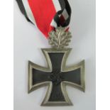 A reproduction WW2 German Knight's Cross with oak leaves; 4.8cm wide.