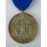 A Nazi German Police medal for 8 years service; 3.5cm diameter.