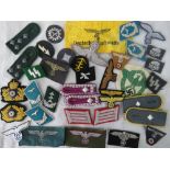 Over 25 Reproduction WW2 Nazi cloth insignia badges and collar tabs.