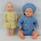 Two plastic bodied dolls, one with sleepy eyes, measuring 35cm and 30cm respectively.