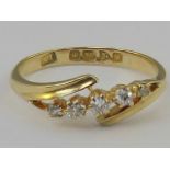 An 18ct gold and diamond ring, a row of