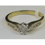 A 9ct gold and diamond ring, central ill