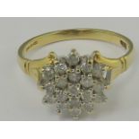 An 18ct gold and diamond cluster ring, t