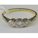 An 18ct gold and diamond ring, three ill