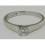 A platinum and diamond solitaire ring, a