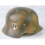 A WWII German Nazi helmet having SS rune