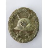 A WW2 Nazi Wound badge in white metal; 4