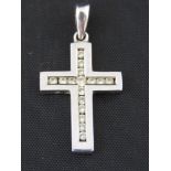 A 9ct white gold and diamond cross penda