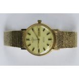 A mens 9ct gold Rotary automatic day/dat