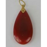 A Carnelian tear-drop in 22ct gold drop