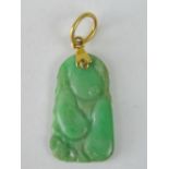 A 20thC Chinese green jade hand-carved relief pendent on 22ct gold drop mount. 2.5cm length. 2.64g.