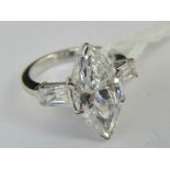 A silver dress ring, central marquise CZ