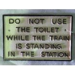 A cast metal square shaped sign ' Do not