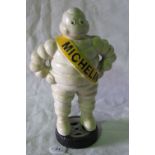 Michelin man ' Mr Bibendum' standing upo